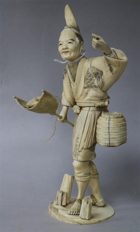 A Japanese ivory figure of a fisherman